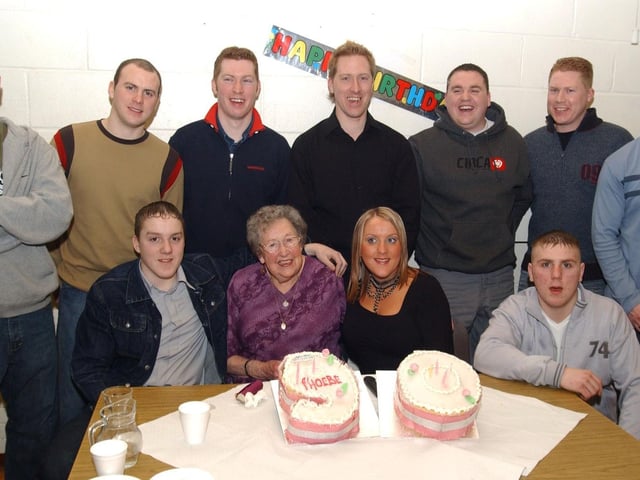 Phoebe Doherty with nine of her grandsons and her only granddaugther in Derry at her 90th birthday party. Included are, Paul, Kevin, David, Joesph, Sean, Brian, Kieran, Christopher, Niell and Carolanne. (2502CG12)