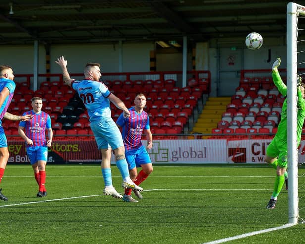 Institute’s Cathair Friel heads home their first goal against Ards, on Saturday.  Picture by: George Sweeney.  DER2241GS – 72