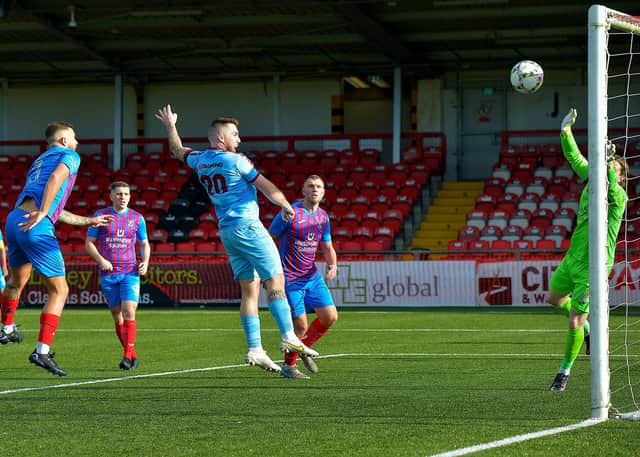 Institute’s Cathair Friel heads home their first goal against Ards, on Saturday. Picture by: George Sweeney. DER2241GS – 72