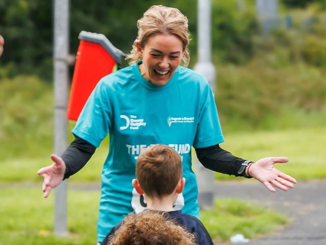 One happy participant at the finsih line of the Danny Quigley Try-a-Tri event. (Photo: Micam Photography)