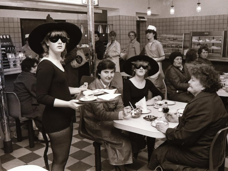 Wellworths café waitresses in Halloween fancy dress with customers.