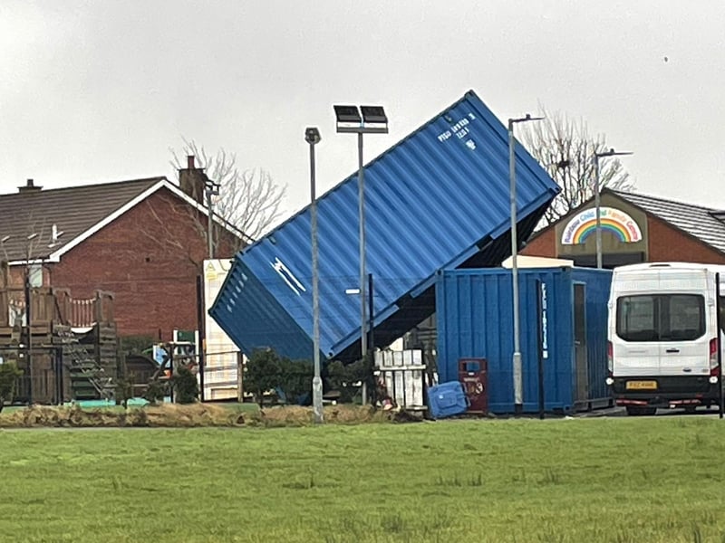 A shipping container blown over by Storm Éowyn at the Rainbow Centre in Galliagh.