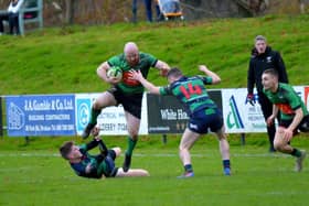 City of Derry’s Davy Graham gets by Clogher Valley pair David Wilson and Adam Boles last week at Judges Road. Photo: George Sweeney.  DER2247GS – 122