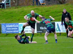 City of Derry’s Davy Graham gets by Clogher Valley pair David Wilson and Adam Boles last week at Judges Road. Photo: George Sweeney.  DER2247GS – 122