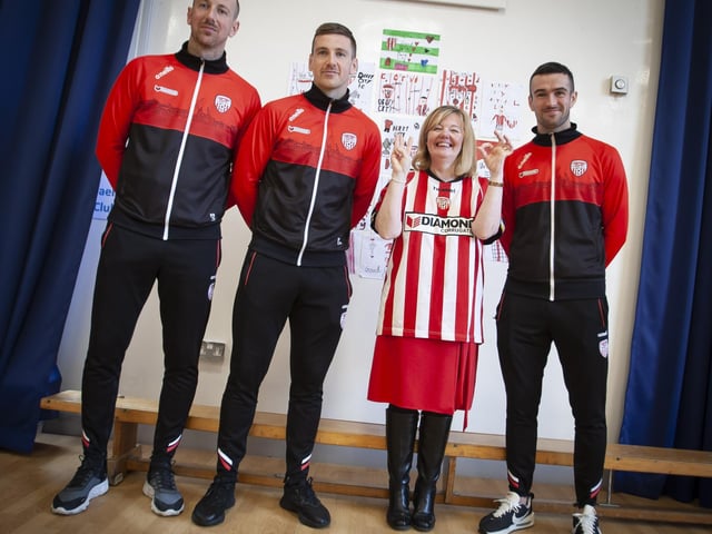 Steelstown P.S. Principal Mrs Siobhan Gillen with Derry City players Shane and Patrick McEleney and Michael Duffy at the school on Tuesday. (Photos: Jim McCafferty Photography)