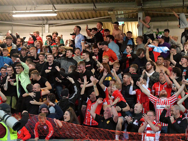 Fans celebrate Derry City’s win over KuPs at the Brandywell. Photo: George Sweeney. DER2330GS -