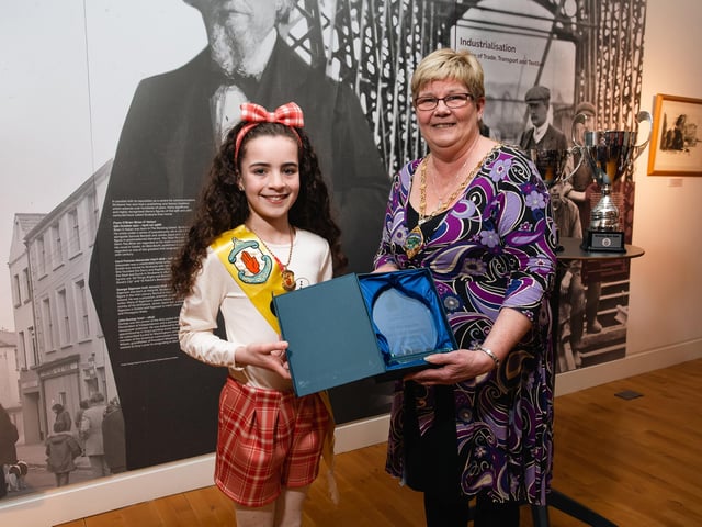 Under-11s Ulster Gold medalist Tori McLaughlin receiving a presentation to mark her success from Derry City & Strabane District Council Deputy Mayor Angela Dobbins.