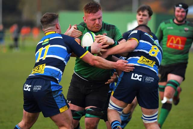 Stephen Corr brushes Dromore players aside to score City of Derry's first try at Judges Road on Saturday last. Photo: George Sweeney