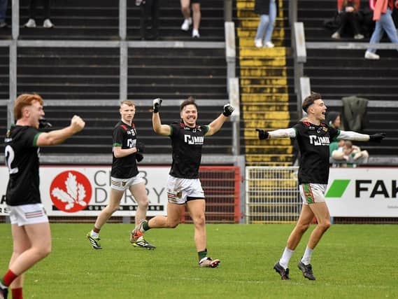 Slaughtmanus players ce;berate winning the Derry Junior Football Championship Joe Brolly Cup at Celtic Park on Sunday afternoon. Photo: George Sweeney