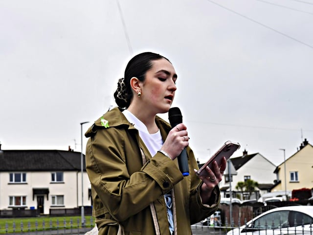 Clara Hutton sings a lament at the Creggan Republican Monument during a commemoration on Easter Sunday afternoon. Photo: George Sweeney