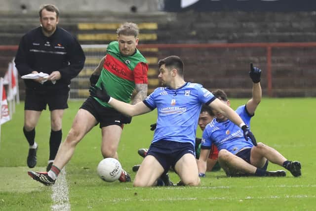 Trasna's Eoghan Quigg goes past Lacken's Peter Galligan in the Ulster GAA Club Junior Football Championship between Doire Trasna v Lacken at Celtic Park on Saturday. (Photo - Tom Heaney, nwpresspics)
