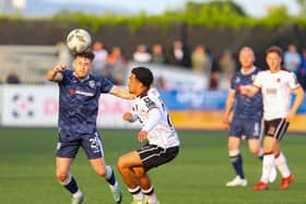 Adam O'Reilly wins this ball ahead of Dundalk's Sam Durrant at Oriel Park. Photographs by Kevin Moore/MCI.