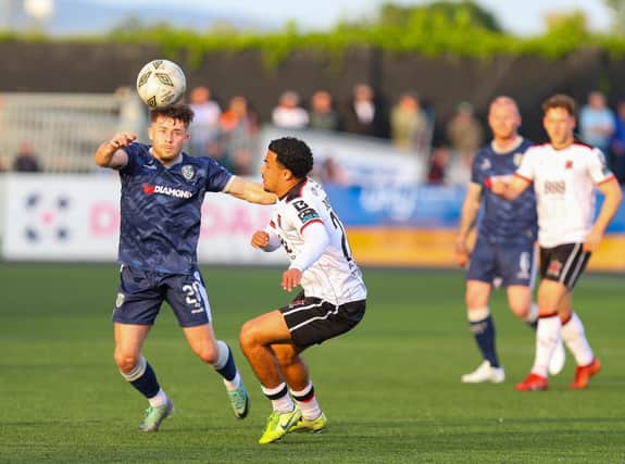Adam O'Reilly wins this ball ahead of Dundalk's Sam Durrant at Oriel Park. Photographs by Kevin Moore/MCI.