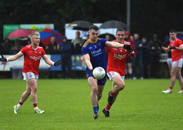 Steelstown's Diarmuid Baker is chased by O'Donovan Rossa's Joe Keenan during Sunday's game at Pairc Brid. Photo: George Sweeney.