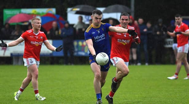 Steelstown's Diarmuid Baker is chased by O'Donovan Rossa's Joe Keenan during Sunday's game at Pairc Brid. Photo: George Sweeney.