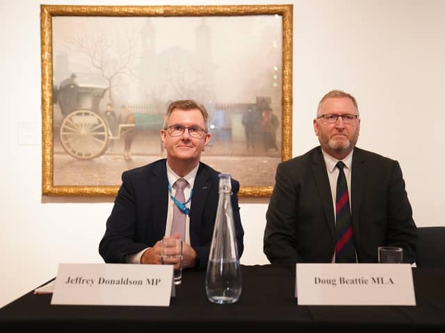 Jeffrey Donaldson and Doug Beattie at the British Conservative Party conference in 2021.