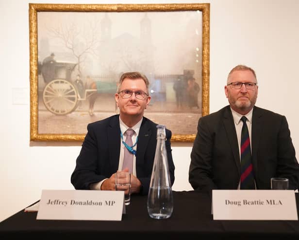 Jeffrey Donaldson and Doug Beattie at the British Conservative Party conference in 2021.