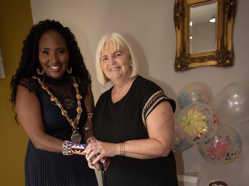 CELEBRATING 25 YEARS AT LONGFIELD. . . .The Mayor, Lillian Seenoi-Barr and Louise Carroll, Care Home Manager, cutting the cake to celebrate the 25th anniversary of Longfield Care Home on Thursday afternoon last. (Photos: Jim McCafferty Photography)