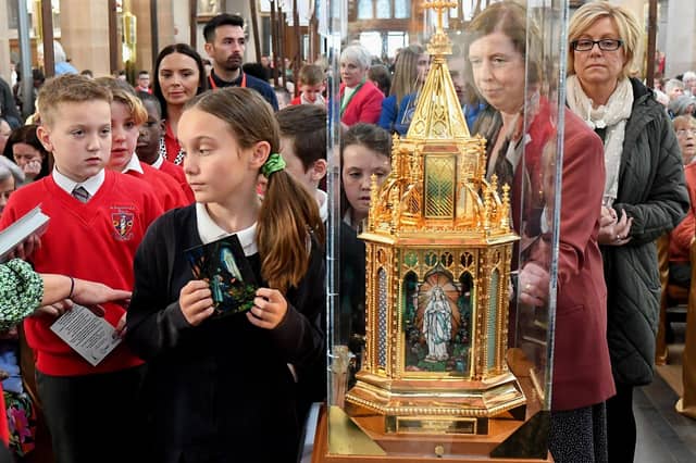 Pupils from the Derry Diocese queue for the veneration of the relics of St Bernadette at St Eugene’s Cathedral on Monday morning. Relics of the saint are being taken on pilgrimage to each of the 26 Catholic dioceses in Ireland. Photo: George Sweeney