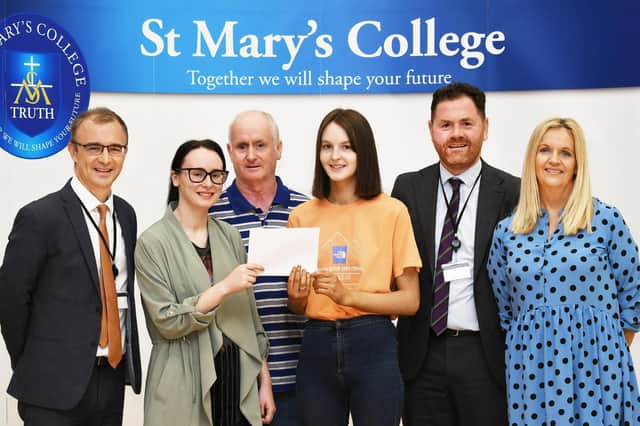 St. Mary's College student Nicole Morrison, who gained an A* and 2 A grades in her 'A' Levels, pictured with her proud parents Shauna and Paul when she collected her results on Thursday morning. Included are, from left, Brendan McGinn, Principal, Conor Lynch, Vice-Principal, and Rona O'Donnell, Head of Sixth Form. Nicole is taking up a place at Ulster University, Magee, to study Social Work.