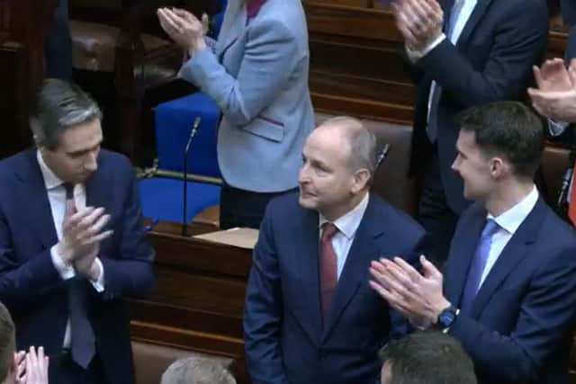Micheál Martin is applauded by Simon Harris and Jack Chambers after he was elected Taoiseach on Thursday.