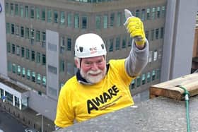 Bernard McAnaney, Chairperson of AWARE NI, taking part in last year’s City Hotel Abseil.