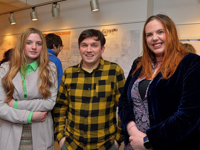 Street Artist and illustrator Elph One aka Brian McFeely pictured relatives Maggie and Donna McFeely at the launch of his ‘Doodles in Derry’ exhibition on Saturday in the UV Arts ‘The Urban Art Gallery’ in Bishop Street. Photo: George Sweeney. DER2301GS – 57