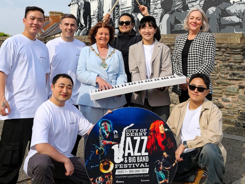 The Mayor of Derry and Strabane Patricia Logue and Council Jazz Festival Coordinator Andrea Campbell with South Korean Jazz band Odd Meter Fairy and the JazzysCredit © Lorcan Doherty