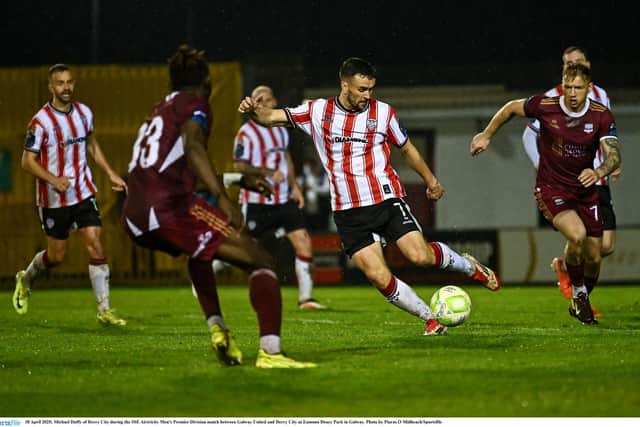 Michael Duffy swings in a cross against Galway United.