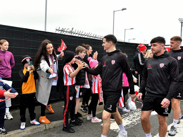 Derry City players greet fans gathered at Brandywell Stadium on Saturday morning prior to their departure for Dublin ahead of Sunday’s FAI Cup Final against Drogheda United. Photograph: George Sweeney.