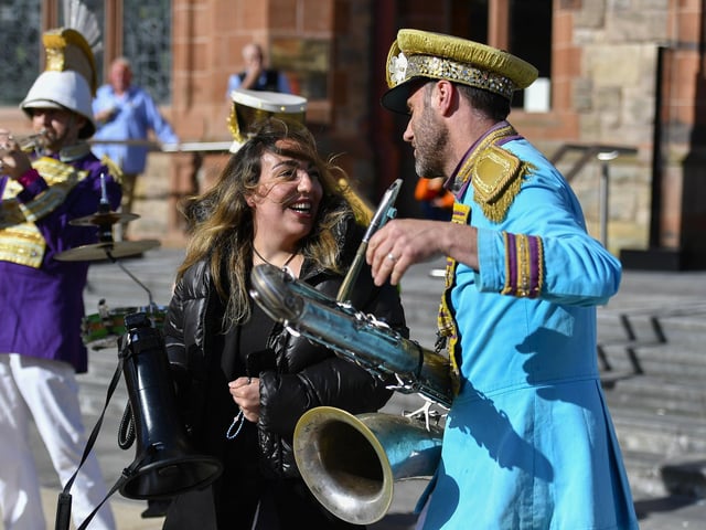 Jazz fan and Will Lenton Mr Wilson’s Second Liners in Guildhall Square. Photo: George Sweeney