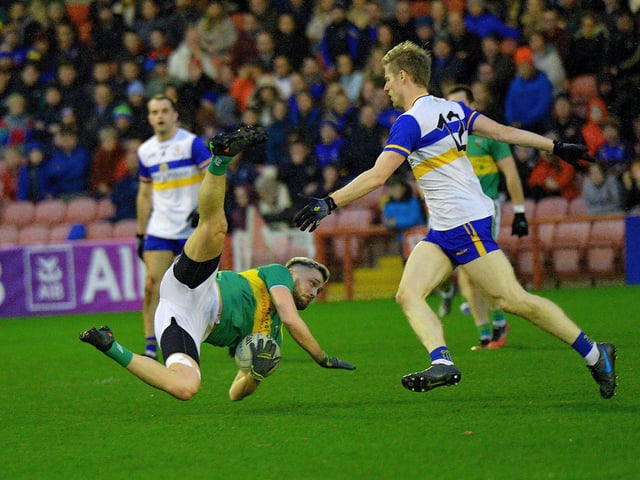 Glen’s Ryan Dougan gets to the ball before Errigal Ciaran’s Padraig McGirr during the Ulster Senior Club Championship quarter- final at Celtic Park on Sunday afternoon last. Photo: George Sweeney.  DER2246GS - 023