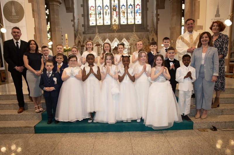 Pupils from Mr. Joe Kennedy's class at St. Eugene's Primary School who received the Sacrament of First Holy Communion from Fr. Shaun Doherty at St. Eugene's Cathedral on Friday last. Included are Ms. Gemma McIvor, teaching assistant, Mrs. Carol Duffy, principal and Ms. Joanne Sheerin, teaching assistant. (Photos: Jim McCafferty Photography)