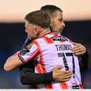 Could Dom Thomas, pictured here being congratulated by manager Tiernan Lynch, be on his way out of Brandywell this summer? Photo by Ramsey Cardy/Sportsfile