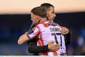 Could Dom Thomas, pictured here being congratulated by manager Tiernan Lynch, be on his way out of Brandywell this summer? Photo by Ramsey Cardy/Sportsfile