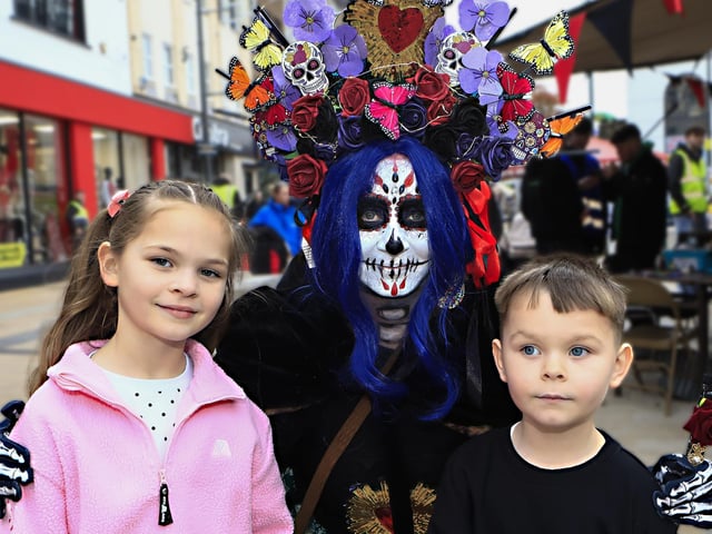 Allah and Arlo with the “Living Doll” in Waterloo Place on the 40th anniversary of the Halloween celebrations. (Photo - Tom Heaney, nwpresspics)