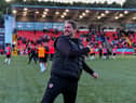 Derry City manager Ruaidhri Higgins salutes fans.
