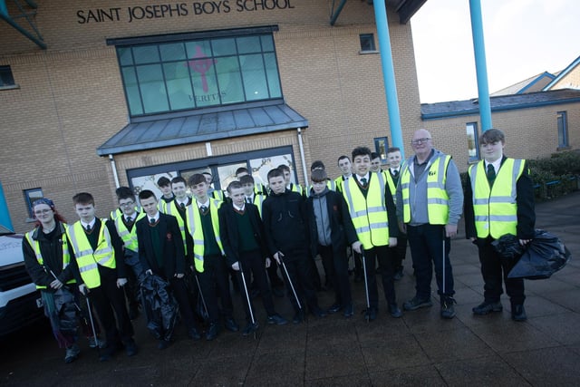 SCHOOL CLEAN-UP!. . . . Kevin Campbell and Ellie Savage pictured with Year 8 students from St. Joseph's Boys School on Wednesday before taking part in a clean up of the local area. The event was part of Feile Derry's new festival Equinox.