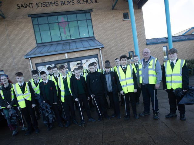 SCHOOL CLEAN-UP!. . . . Kevin Campbell and Ellie Savage pictured with Year 8 students from St. Joseph's Boys School on Wednesday before taking part in a clean up of the local area. The event was part of Feile Derry's new festival Equinox.