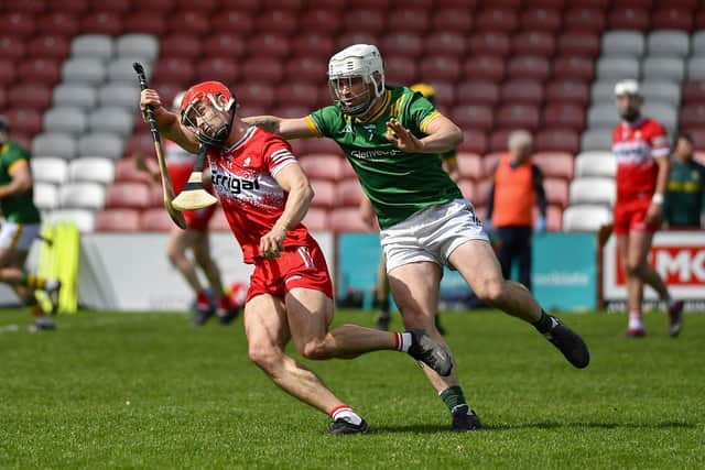 Meath’s Sean Coloe fouls John Mullan of Derry. Photo: George Sweeney