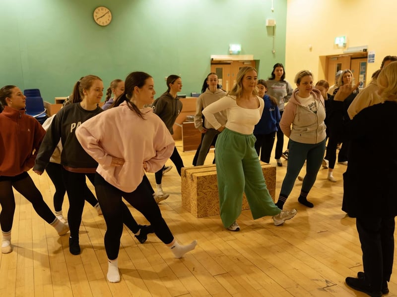Members of the ensemble in rehearsal for Oklahoma.