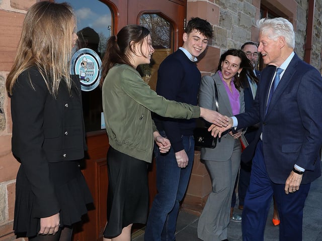 Bill Clinton meets members of John Hume's family at the Guildhall.