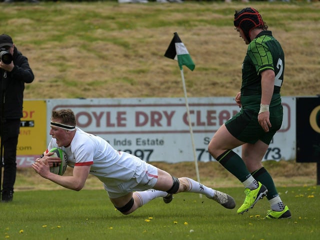 Ulster’s Curtis Pollock scores a try as Connacht’s Ben Hynes looks on. Photo: George Sweeney