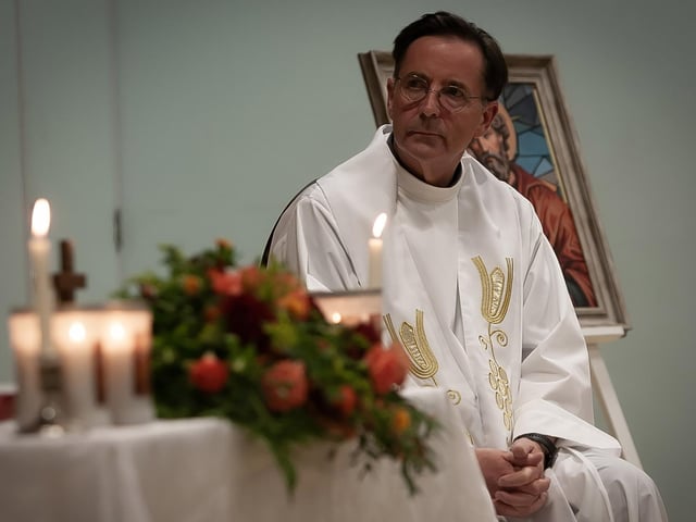 St. Joseph's Boys School Chaplain, Fr. Shaun Doherty listening to the readings during Thursday's Mass.
