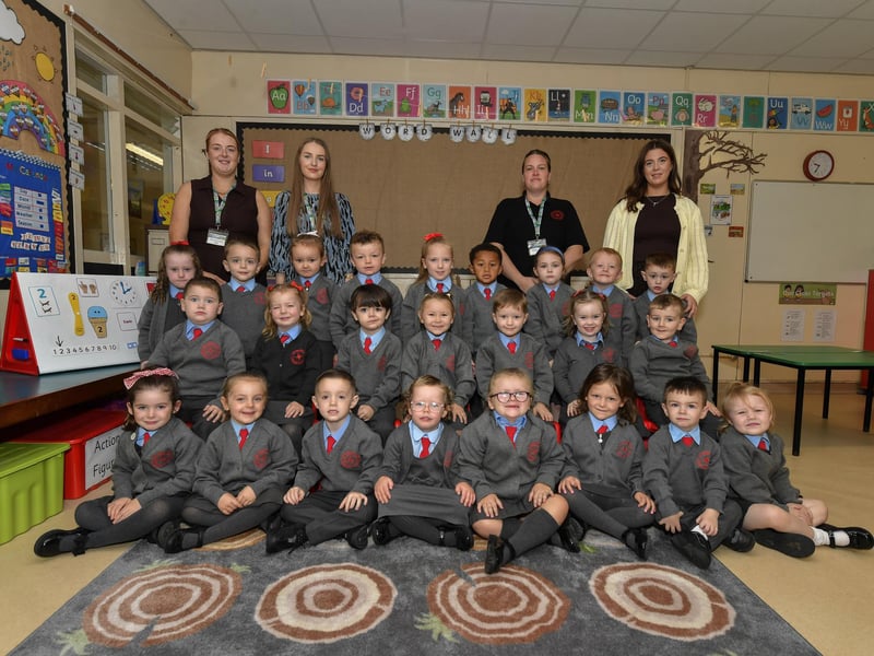 Miss Cunningham pictured with P1 pupils and classroom assistants at St Brigid’s Primary School.
