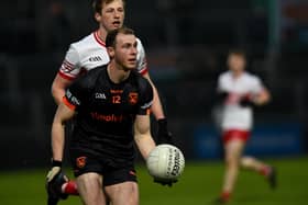 Brendan Rodgers closes in on Armagh's Justin Kieran during the Oak Leafers' McKenna Cup semi-final victory in the Athletic Grounds on Saturday. (Photo: John Merry)