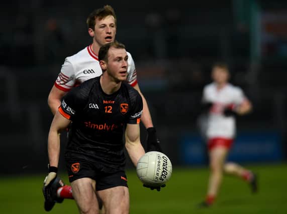 Brendan Rodgers closes in on Armagh's Justin Kieran during the Oak Leafers' McKenna Cup semi-final victory in the Athletic Grounds on Saturday. (Photo: John Merry)