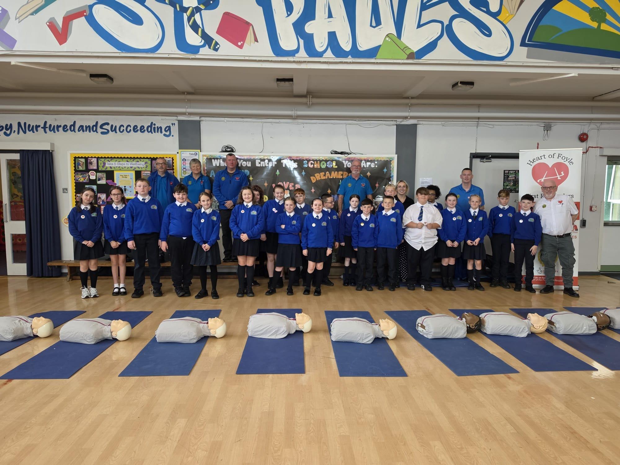 Heart of Foyle volunteers with pupils from St Paul's Primary School in Galliagh.