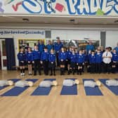 Heart of Foyle volunteers with pupils from St Paul's Primary School in Galliagh.