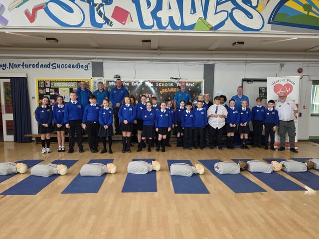 Heart of Foyle volunteers with pupils from St Paul's Primary School in Galliagh.